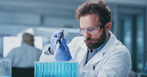 Science, experiment and man in lab, test tube for cure and solution for vaccine. Stock Footage 330038840
