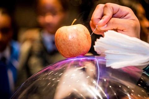 Science experiment using electricity to carve into an apple. Close up view Stock Photos