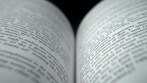 A science fiction book opened up, close-up, dolly in Stock Footage 114060190