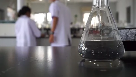 Science Glassware in a research quality control in Chemical Laboratory Stock Footage 112528377