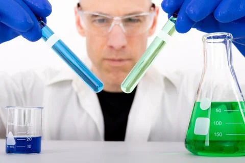 Science Guy Comparing Vials Stock Photos