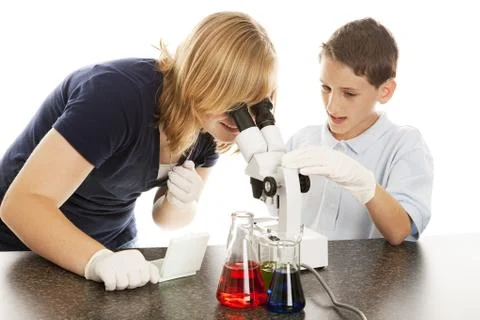Science Kids Look in Microscope Stock Photos