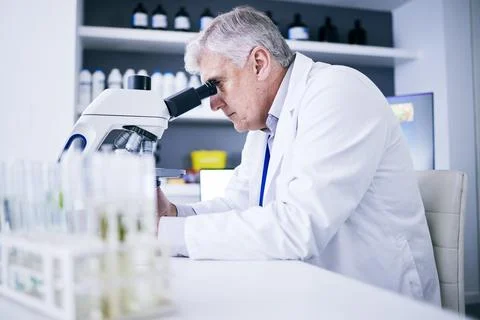 Science, laboratory and man on microscope for plants research, medical analysis Stock Photos