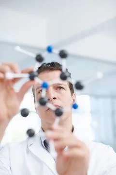 Science, laboratory and man with molecule structure for hypotheses testing and Stock Photos