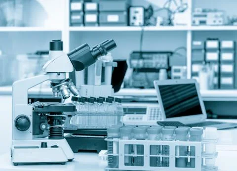Science laboratory with a microscope, biological material samples and a computer Foto stock