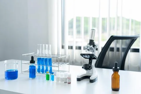 Science, laboratory tools set on the white table. microscope, tubes in the ra Foto stock