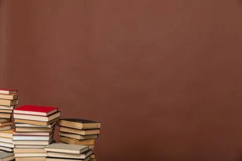 Science learning library education stack of books on brown background Stock Photos