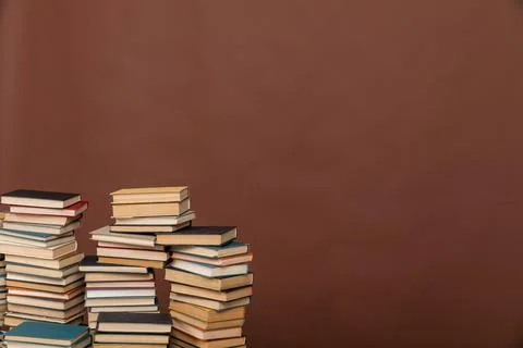 Science learning library education stack of books on brown background Stock Photos