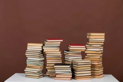 Science learning library stack of books on brown background Stock Photos