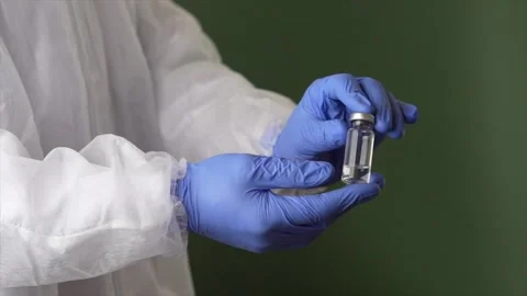 Science matters. Lab assistant in personal protective equipment or PPE suit Stock Footage 147961406