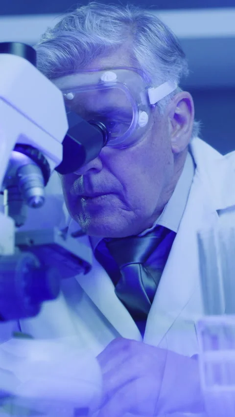 Science, mature or man in lab with microscope, test or examination for Stock Footage 335784225