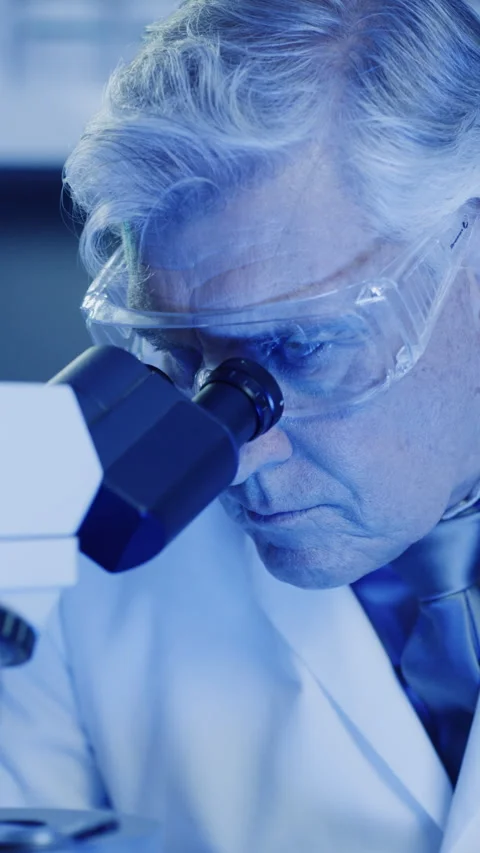 Science, mature or man in laboratory with microscope, test or examination in Stock Footage 335741723