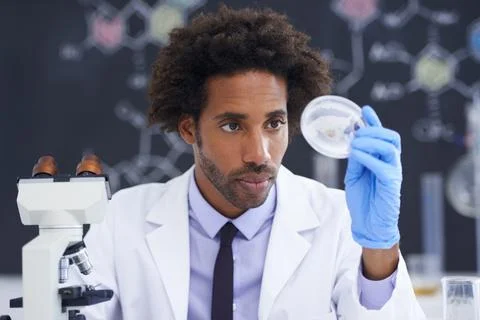 Science, microscope and man with sample in glass for test, medical research for Stock Photos