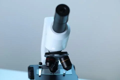 Science. Microscope with glass slide on blurred background, closeup Stock Photos