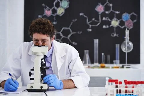Science, notes and man with microscope for research in chemistry, pathology and Stock Photos
