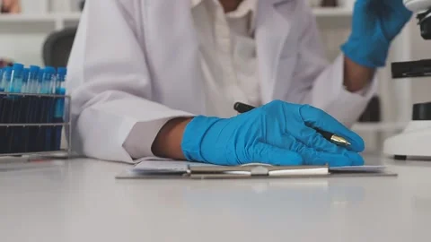 Science, research and hands in lab with notebook and computer on scientific.. Stock Footage 344457716