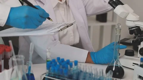 Science, research and hands in lab with notebook and computer on scientific.. Stock Footage 344457914