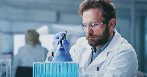 Science, research and man in lab, test tube for experiment and solution for Stock Footage 330038015
