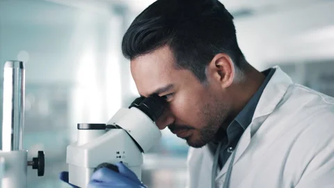 Science, research and microscope by man scientist in a laboratory for Pharma 스톡 동영상 247542111