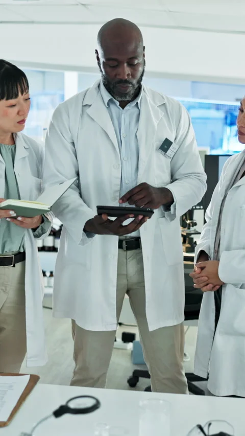 Science, review or group in lab with tablet, problem solving or feedback on Stock Footage 333166370
