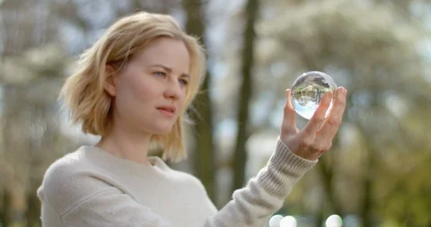 Science student is analysing a glass globe for her research Video stock 106947027