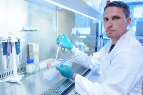 Science student using pipette in the lab 写真素材