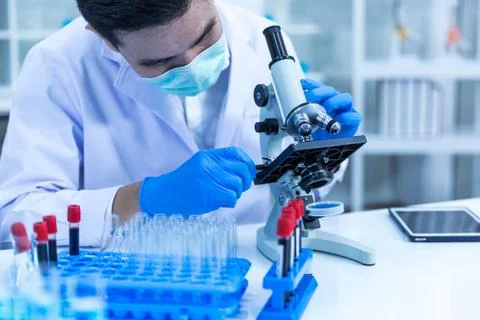 Science students are learning to use a microscope in the laboratory. Stock Photos