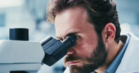 Science, study or man in lab with microscope, investigation or examination .. Stock Photos