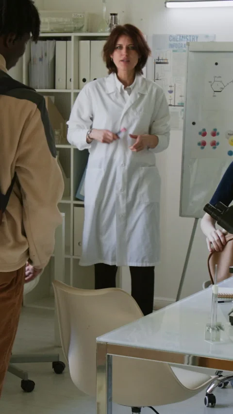 Science Teacher Greeting her Students Stock Video Pond5