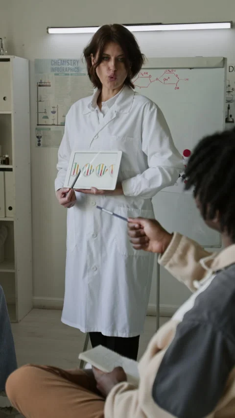 Science Teacher Lecturing Students During Biology Class in Lab Stock Footage 312325028