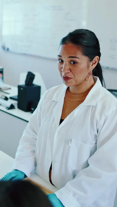 Science, teacher or speaking in classroom with students, chemistry lesson or Stock Footage 332894559