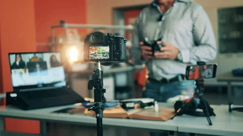Science teacher is showing robotic elements to online students. Online learning Stock Footage 139635620