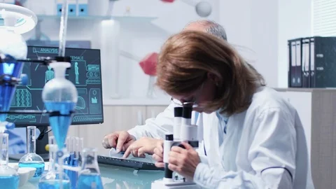 Science team working in modern laboratory Stock Footage 111017687