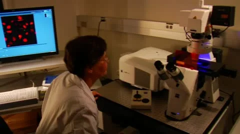 Sciences uses microscope Stock Footage 21534372