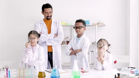 Sciense teacher and multiracial students standing with confidence in the sc.. Stock Footage 243655867