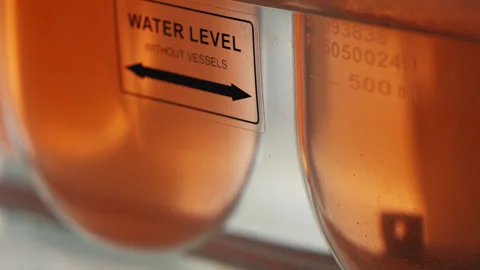 Scientific Automatic Mixer In Laboratory Mixes Chemical Components In Glassware. Stock Footage 264742703