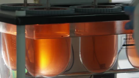 Scientific Automatic Mixer In Laboratory Mixes Chemical Components In Glassware. Stock Footage 308452203