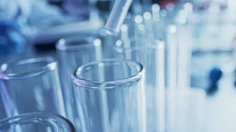 Scientific Lab: Pipette Dropping Red Liquid into Test Tubes, Medical Research. Stock Footage 121782866