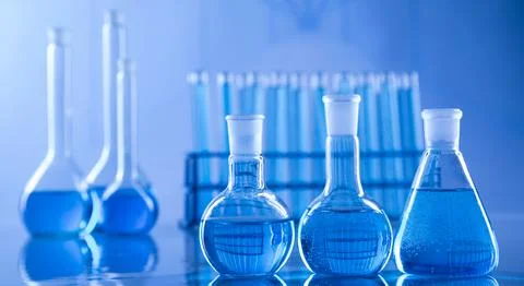 Scientific laboratory experimental glassware background Stock Photos