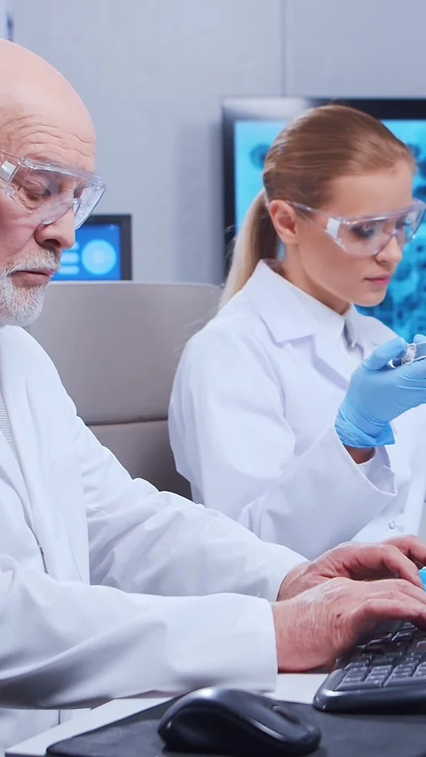 Scientific laboratory filled with various research equipment. Scientists are Stock Footage 304487697