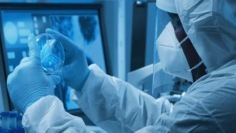 Scientific laboratory filled with various research equipment. Scientists are Stock Footage 304518014