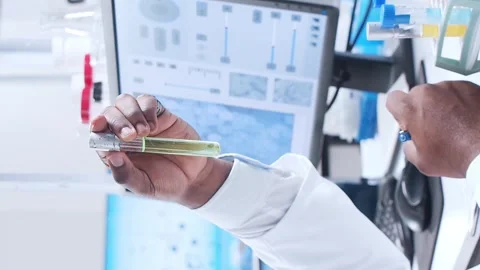 Scientific laboratory filled with various research equipment. Scientists are Stock Footage 304522843