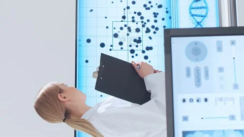Scientific laboratory filled with various research equipment. Scientists are Stock Footage 304524779