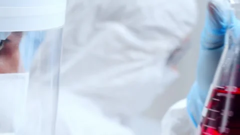 Scientific laboratory filled with various research equipment. Scientists are Stock Footage 307393448