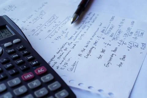 Scientific math workout. sheet paper with solving equation math next to calcu Foto stock
