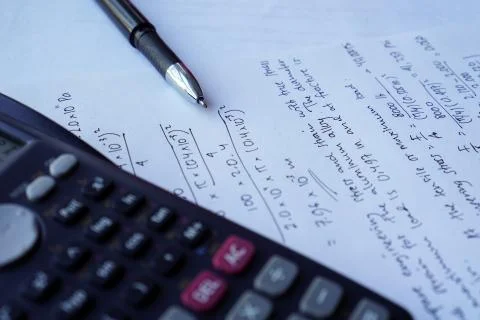 Scientific math workout. sheet paper with solving equation math next to calcu Foto stock