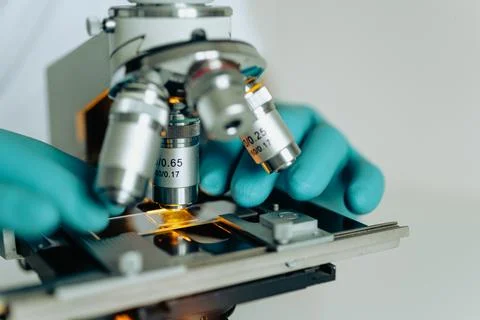 Scientific microscope focus on glass slide Stock Photos