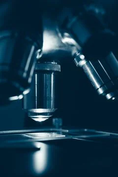 Scientific microscope in modern clean laboratory light Stock Photos
