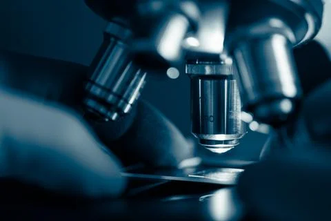 Scientific microscope in modern clean laboratory light Stock Photos