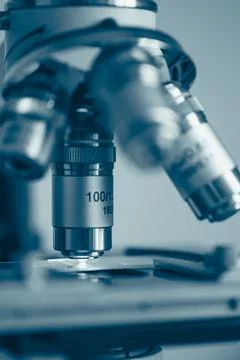 Scientific microscope in modern clean laboratory light Stock Photos